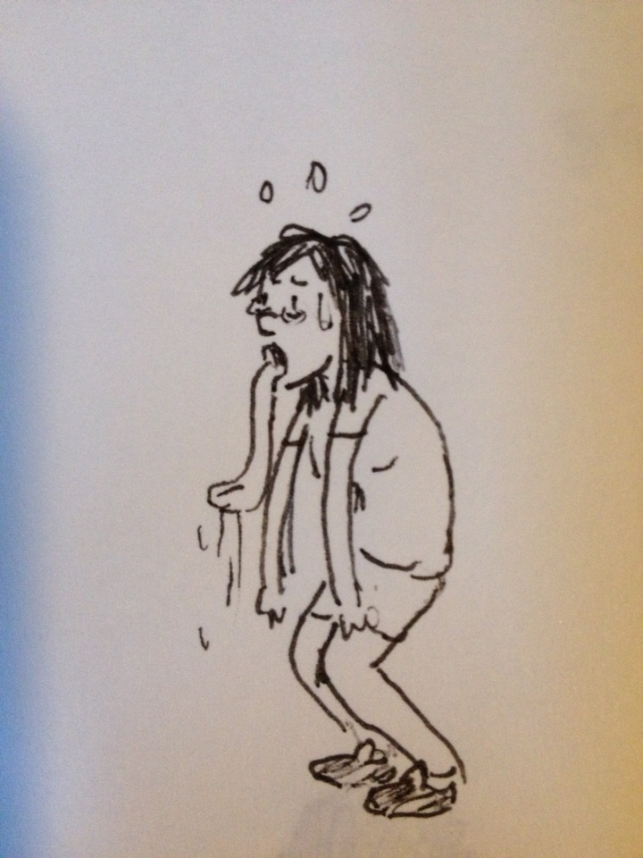 A photo from a sketchbook. A drawing of morphmaker sweating with a long tongue hanging out.